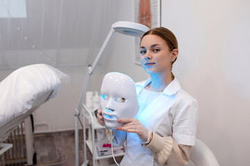 Photodynamic therapy. Cosmetic face mask. the girl is wearing a mask. Health and beauty.