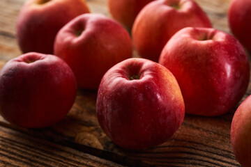 Fresh red apples on a wooden board