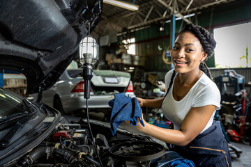 Car mechanic checking  oil quality the engine motor car Transmission and Maintenance Gear. car...