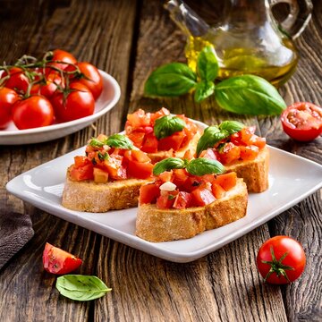Knusprige Bruschetta mit Tomaten, Basilikum und Oliven&ouml;l - Nahaufnahme.
Bruschette Caprese - eine italienische Spezialit&auml;t.
Vegane Mahlzeit.
Vorspeise.