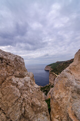 Sea and Dingli cliffs seen through a rocky window, Dingli, Malta