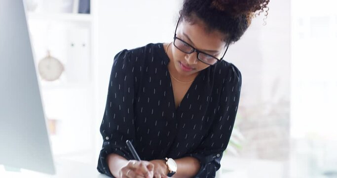 Woman, computer and working in office, writing and serious in notebook for company, startup and business owner. Planning, strategy and technology for job, web and desktop for notes, worker and online