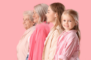 Little girl with her family on pink background