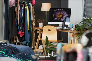 Background image of messy girls room with computer of table, copy space