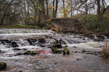 A waterfall formed after the destruction of an old mill