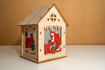 Santa and reindeer in a wooden cabin decoration