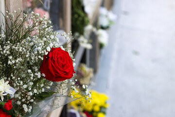 Remembrance of those who left. Flowers on graves in a cemetery.