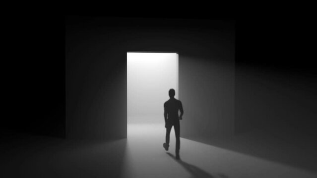 a man walks through open doors towards the light