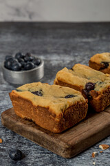 cut blueberry pudding on wood ready to eat