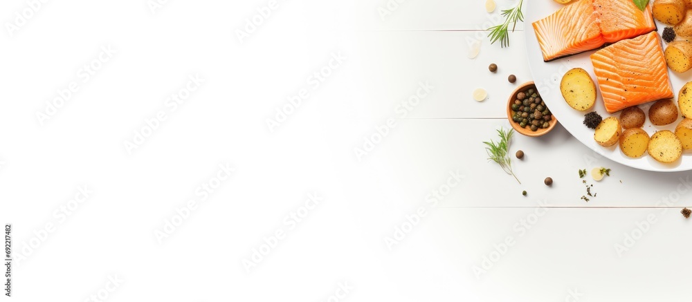 Poster baked salmon steak and roasted potatoes on a white plate horizontal view from above flat lay free sp