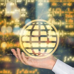 A student or scientist hold a globe of gravitational force