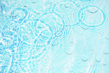 Fototapeta na wymiar Bluewater bubbles on the surface ripples. Defocus blurred transparent white-black colored clear calm water surface texture with splash and bubbles. Water waves with shining pattern texture background