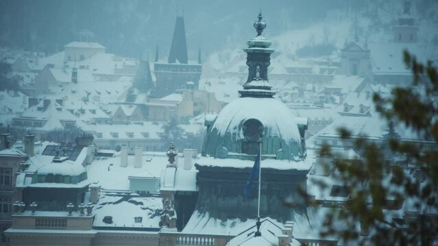 landscape in winter in Prague, Czech Republic with Straka Academy dome.