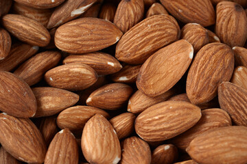 Dried almonds. Almond background. Heap of dry nuts