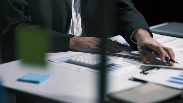 Business intelligence and data analysis concept. Team of analyst working on financial data analysis dashboard on paper as marketing indication for business strategic planning. Insight