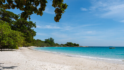Koh Samet Island Rayong Thailand, a white tropical beach of Samed Island with a turqouse colored ocean in the afternoon sun