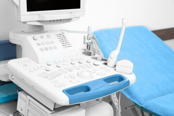 Ultrasound machine and examination table in hospital, closeup