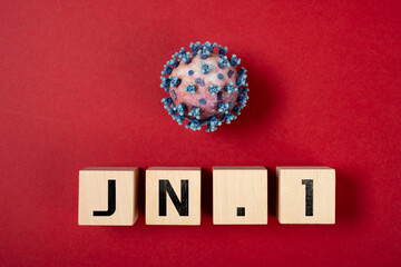 coronavirus and JN.1 variant on a red background