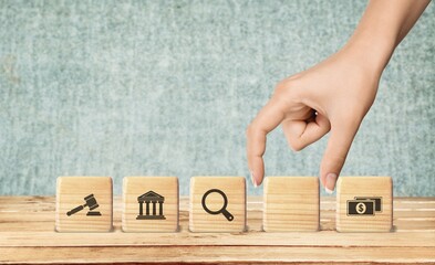 regulations and compliance financial icons on wooden cubes