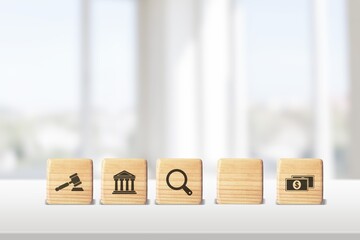 regulations and compliance financial icons on wooden cubes