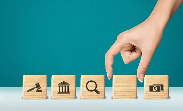 regulations and compliance financial icons on wooden cubes