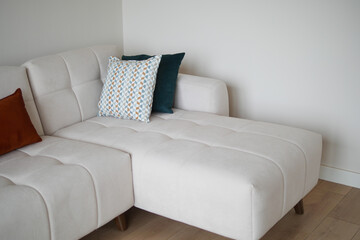 modern sofa with pillows in living room at home