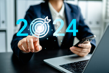 Positioning business plan strategy goal in 2024, achieve start 2024 business growth future, Road to target from 2023 to 2024, New year, Businesswoman pointing to target 2024 target icon.