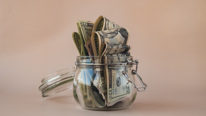 Dollar banknote saving money in glass jar. Consumption and economy Collecting money. Tips....