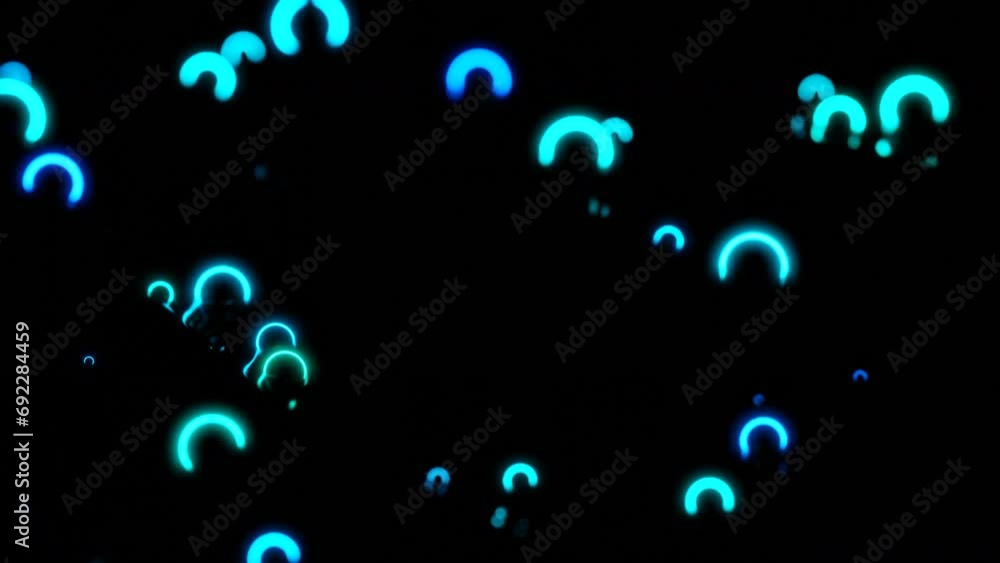 Poster neon rings move and vibrate in space. design. small neon rings vibrate in dark space. luminous rings