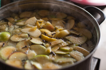 Photograph of a pot full of chopped apples to be boiled. Concept of food preparation.