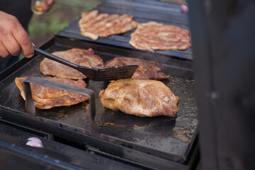 Photograph grill with pork meat cooking. Food preparation concept.