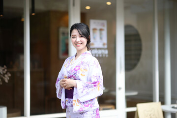 Japanese woman in yukata in coffee shop