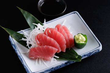 Tuna sashimi isolated in black background
