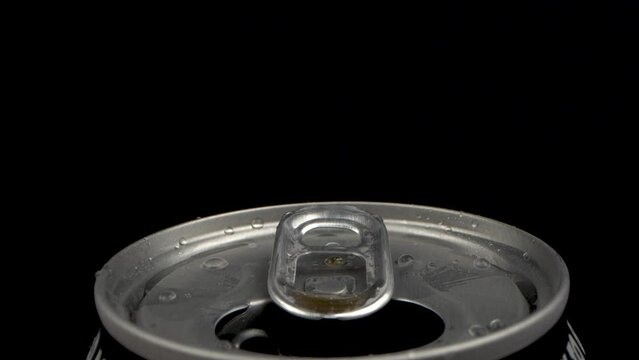 Macro of Open Soda Can Tab with Droplets. Probe lens macro shot