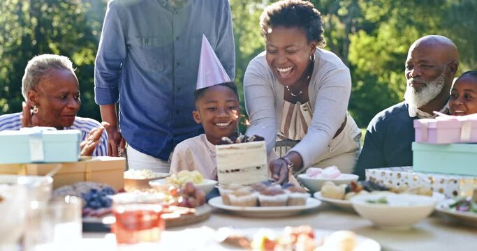 Child, happy birthday and blow candles in outdoor celebration, party and cake or singing at park. Black family, happiness and support for son, cheers and event or together, garden and food or love