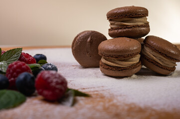 chocolate desserts on a light background close-up, with raspberries and blueberries. Christmas festive background