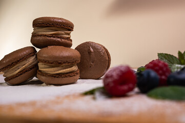 chocolate desserts on a light background close-up, with raspberries and blueberries. Christmas festive background