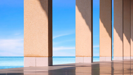 Row of exposed aggregate cobblestone rectangular columns on concrete floor with light and shadow on surface against blurred sea view background, perspective and inside view