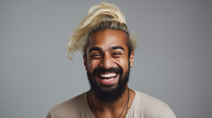 Obraz premium Happy young indian man with beard and stylish white hairstyle. Studio portrait. AI generated.