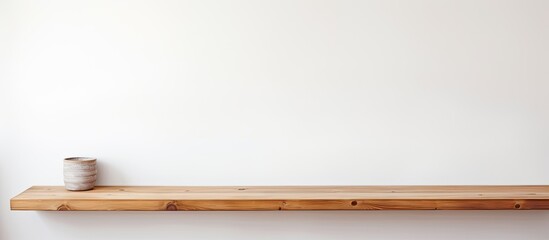 Table made of wood against a wall that is white.