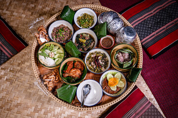 Khantoke, the traditional northern Thai style (Lanna) food with variety of delicious menus such as Nam-prig-Nhum (Green chili dip), local soup, Sai Aua (Thai spicy sausage), crispy pork skin