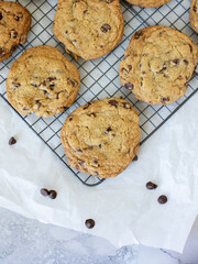 homemade chocolate chip cookies on white marble background