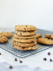 homemade chocolate chip cookies on white marble background