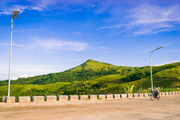Landscape with mountains and blue sky along the road. Cabaliwan Peak, Romblon, Philippines.