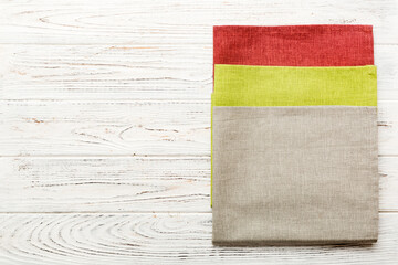 top view with gray kitchen napkin isolated on table background. Folded cloth for mockup with copy...