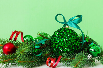 New Year Christmas tree toy, branches of a christmas tree, New Year decorations on a colored background