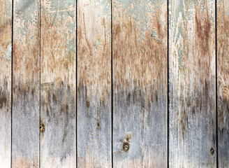 Naklejka premium Boards on an old wooden fence as an abstract background. Texture