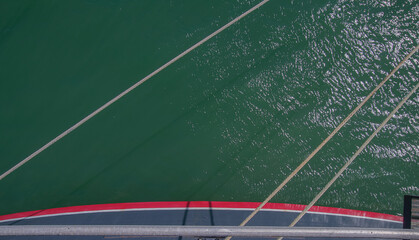Detail view of stern waterline and ropes holding luxury British cruiseship cruise ship liner at pier