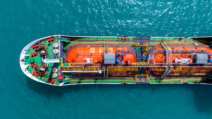 Aerial top view LPG gas ship, Ship tanker gas LPG top view on the sea for transportation, Liquefied Petroleum Gas tanker or LPG anchored in deep blue ocean sea.