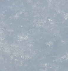 White snowflakes in winter as an abstract background. Texture